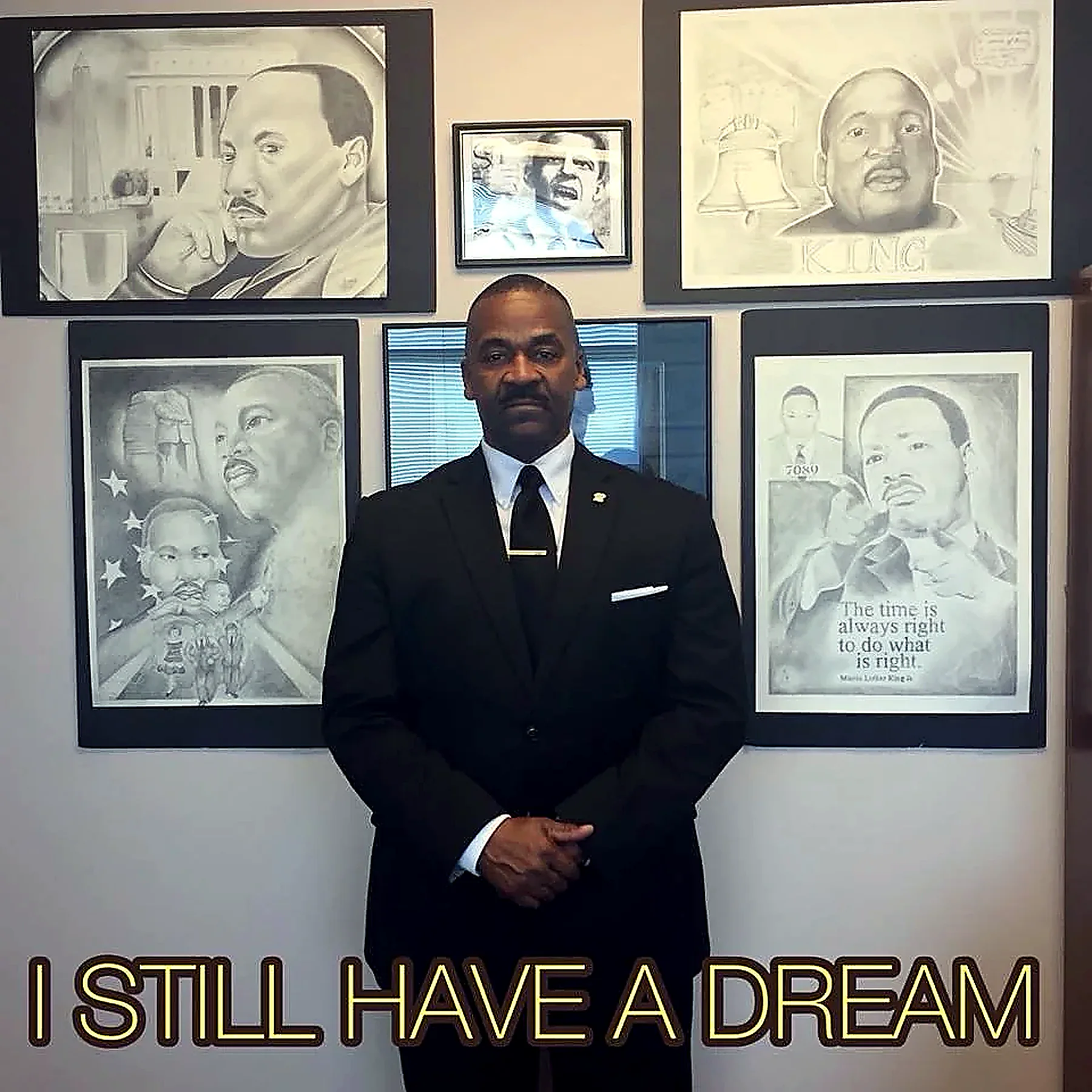 Rev. Moore with artwork honoring Dr. Martin Luther King Jr.